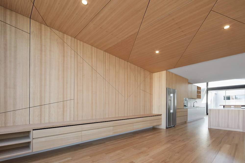 Geometric wall paneling solutions in the interior wall and ceiling of residential home