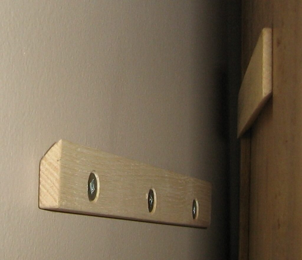 Image showing French Cleats, a common solution to hang access wall panels